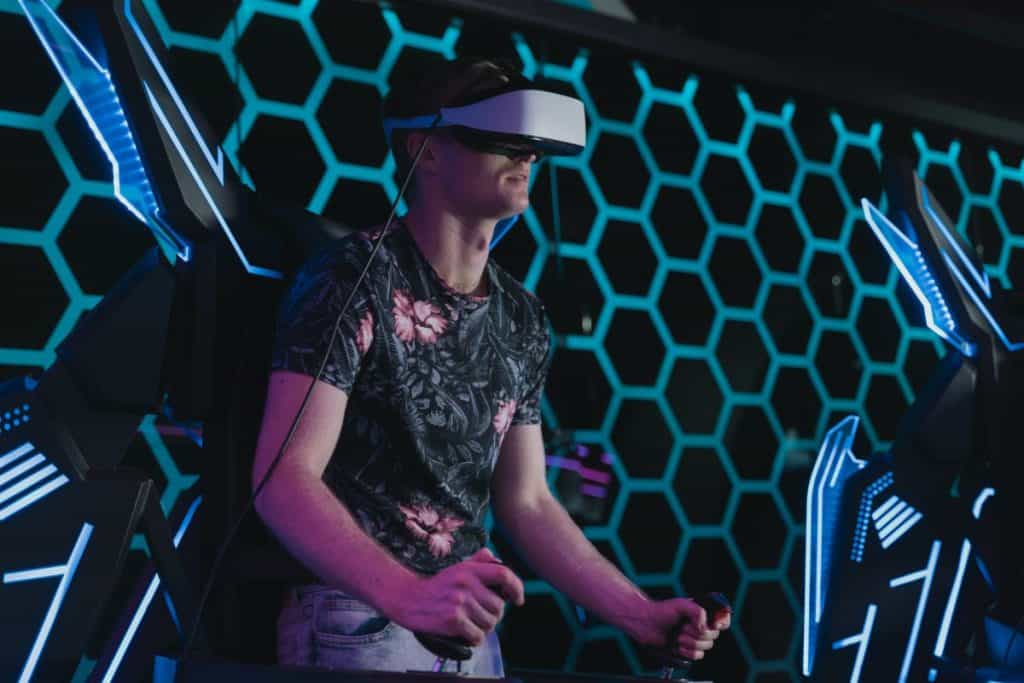 Man wearing VR goggles playing game